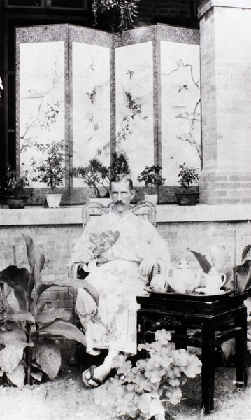 J.B. Affleck (British Consular Service), wearing a Japanese kimono and geta, with bonsai, Beijing (北京)