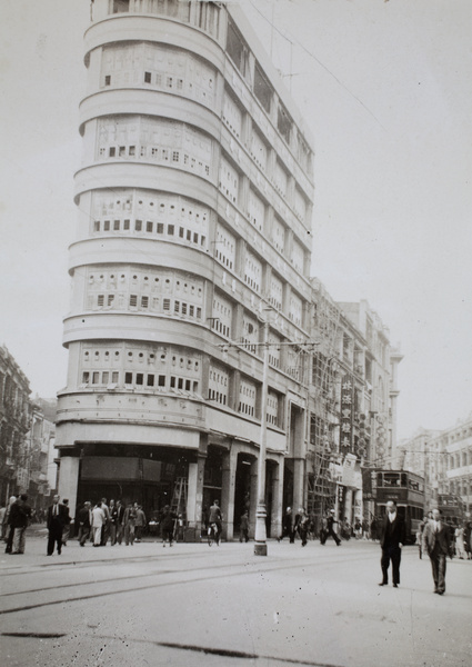 A flat iron shaped building at junction of Des Voeux Road Central and Wing Lok Street, Hong Kong