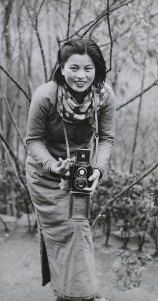 Min Chin with a camera, Northern Hot Springs, 1940