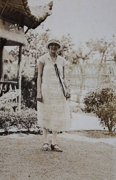 Mabel Hutchinson wearing a summer dress in the garden, 35 Tongshan Road, Hongkou, Shanghai