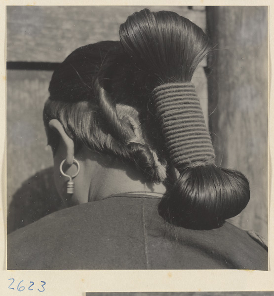 Woman with teapot hairstyle and earrings in the Lost Tribe country