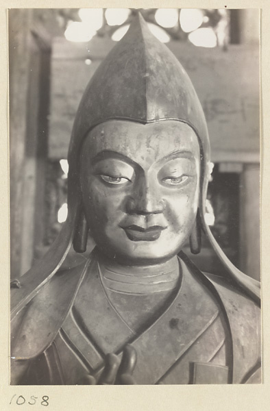 Detail showing the head of a statue of a Lama