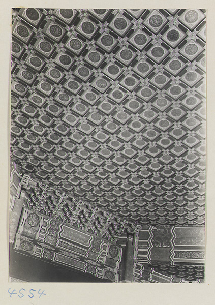 Interior of Guo zi jian showing detail of coffered ceiling with painted decoration