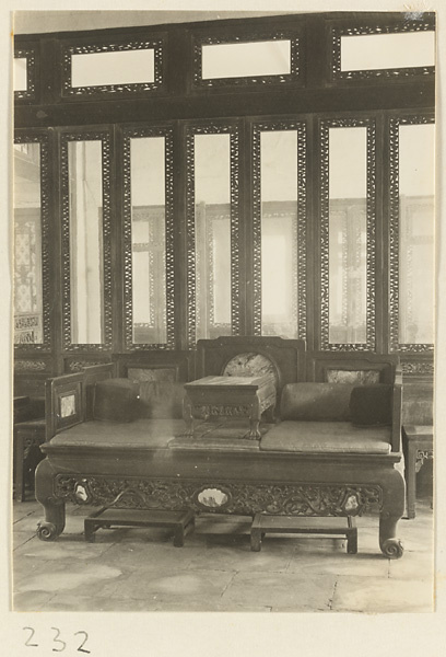 Building interior showing carved wooden kang at the New Wu Garden
