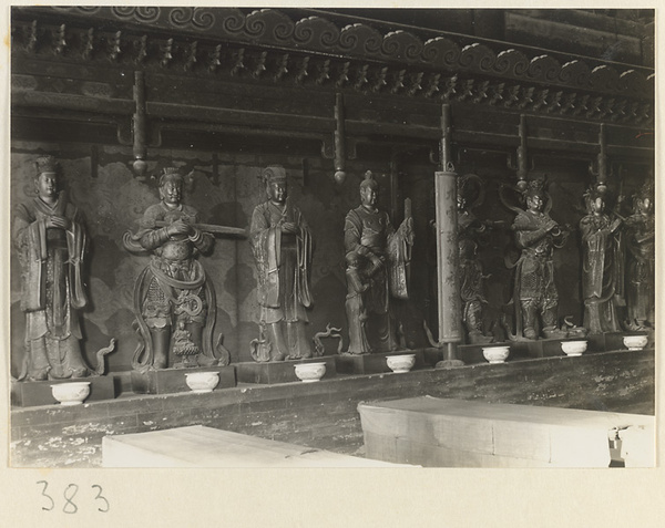 Interior view of temple building showing eight shrine figures and inscription at Da jue si