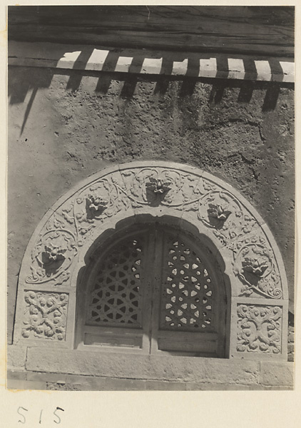 Building detail showing marble archway with carved relief work at Yuquan Hill