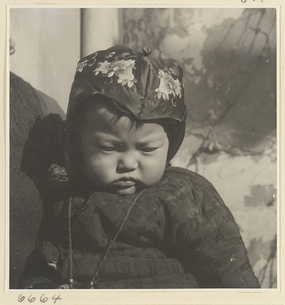 Child wearing an embroidered hat