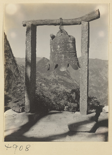 Inscribed cast-iron bell and clapper (top left) suspended from an arch near Sky Ladder on Hua Mountain