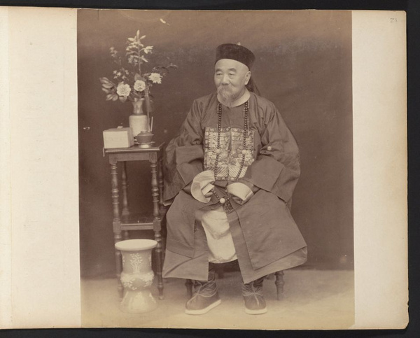 Unidentified Chinese government official wearing traditional hat and surcoat with Mandarin square