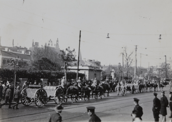 Japanese artillery units taking part in victory parade, passing the British Consulate, Shanghai, 1937