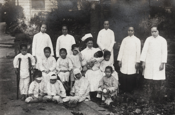 Dr Eleanor Whitworth Mitchell, with hospital staff and patients, Hong Kong