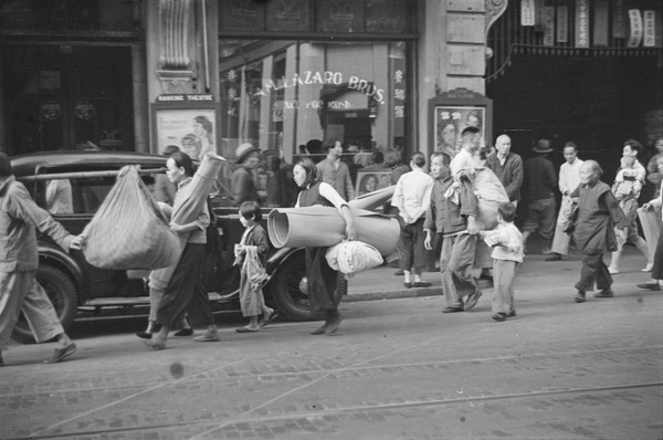 Refugees outside Sam Lazaro Bros music shop (賚瑞羅音樂所), Nanjing Road, Shanghai