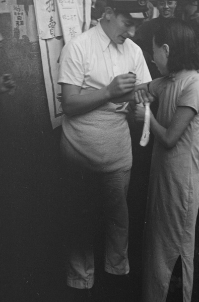 Woman inoculated in the street, Shanghai