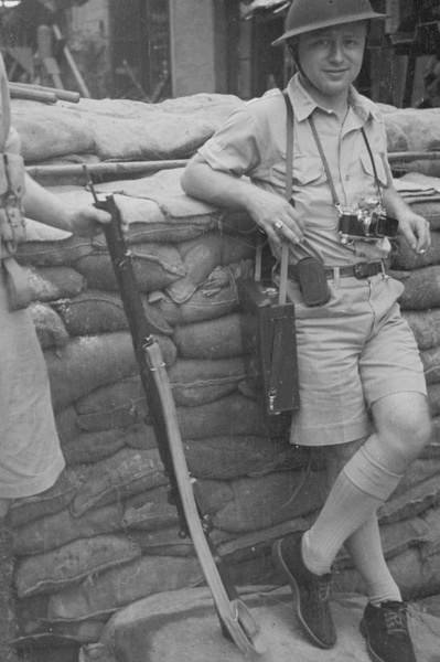 George Lacks by a sandbagged barricade, Shanghai