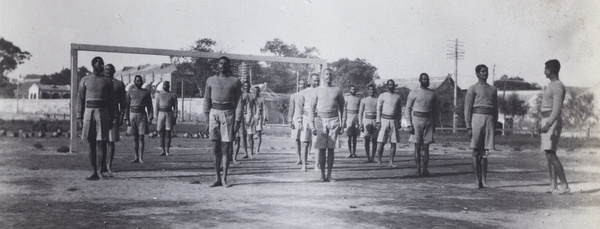 Indian soldiers drilling on a football (soccer) field, Peking