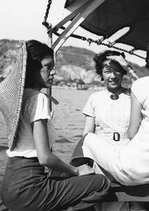 Three unidentified women on a ferry boat, Hong Kong
