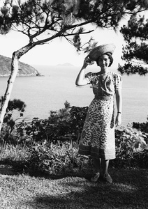 Bea Hutchinson modelling a staw hat, in an area above 12 Milestone Beach, Castle Peak Road, Hong Kong