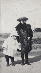 Two children wearing fur coats, Shanghai