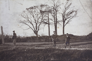 Dick and Fred Hutchinson standing beside a field, Hongkou, Shanghai