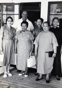 Sarah Hutchinson with a group of unidentified people, Hong Kong