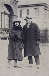 Margie and Charles Hutchinson, dressed for a winter excursion, in the garden of 35 Tongshan Road, Hongkou, Shanghai