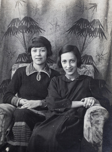 Mabel Parker with an unidentified young woman sitting in an armchair, 35 Tongshan Road, Hongkou, Shanghai