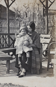 Bea Hutchinson with an unidentified woman sitting in the summerhouse, 35 Tongshan Road, Hongkou, Shanghai
