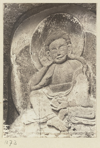 Building detail showing relief carving of a Buddha