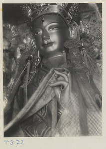 Detail of a Lamaist deity at Yong he gong showing head with third eye and hand