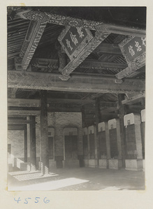 Interior of building at Guo zi jian showing stone tablets with inscriptions and ceiling with inscribed boards