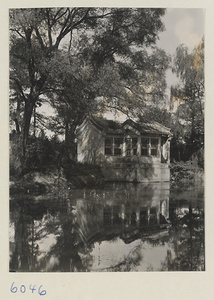 Small building at water's edge in residential compound of E.K. Smith at Yenching