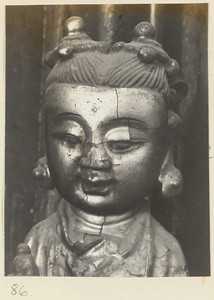 Detail showing the head of a figurine at Tan zhe si