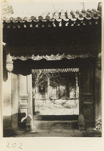 Open door, doorstones, and view of courtyard at the Old Wu Garden
