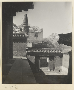 Courtyard, gate, and stupa-style pagoda on Back Hill at Yihe Yuan