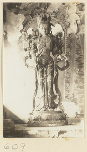 Temple interior showing a statue of a Bodhisattva at Huang si