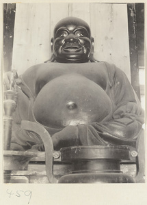 Detail of a statue of the laughing Buddha at Fa yuan si