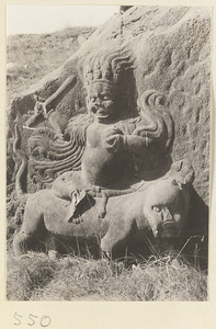 Relief figure of a Bodhisattva seated on an animal carved into the hillside at Yuquan Hill