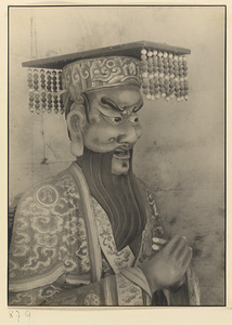Interior of Wan shan dian showing shrine figure wearing a mian liu hat