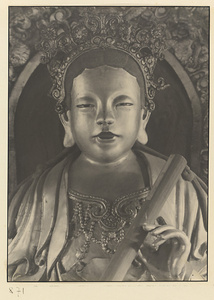 Interior of Wan shan dian showing detail of shrine figure seated on a carved animal