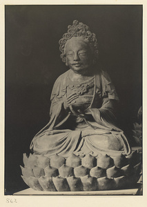 Interior of Wan shan dian showing statue of Bodhisattva seated on a lotus throne