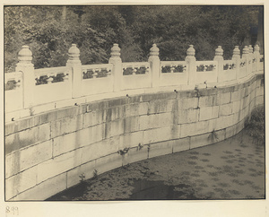 Curved marble balustrade at water's edge at Nanhai Gong Yuan