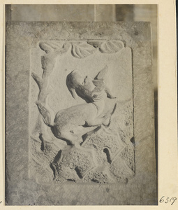 Carved door stone with animal motif