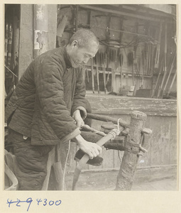 Man making a bow in a bow-and-arrow-making shop
