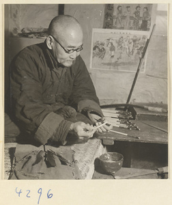 Man making an arrow in a bow-and-arrow-making shop