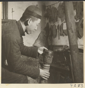 Man at work in a metal-working shop
