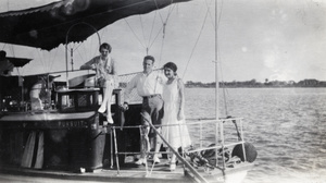John and Phyllis Montgomery with another woman on the houseboat 'Pursuit'