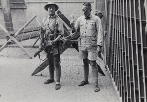 Nationalist soldiers between a gate and a barricade, Shanghai, 1937
