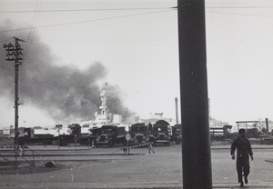 Smoke from Pudong fire billowing up behind USS Augusta, Shanghai, 1937