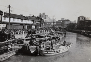 Japanese marines requisitioning Chinese boats, Soochow Creek near Fokien Road Bridge, Shanghai, October 1937