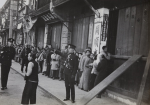 People waiting in a queue for rice, Shanghai, 1937